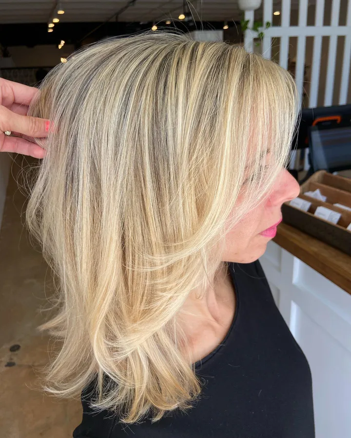 Bright blonde highlights with face-framing layers